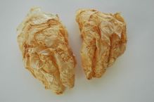grapefruit sculpture hands peels sown together fragile